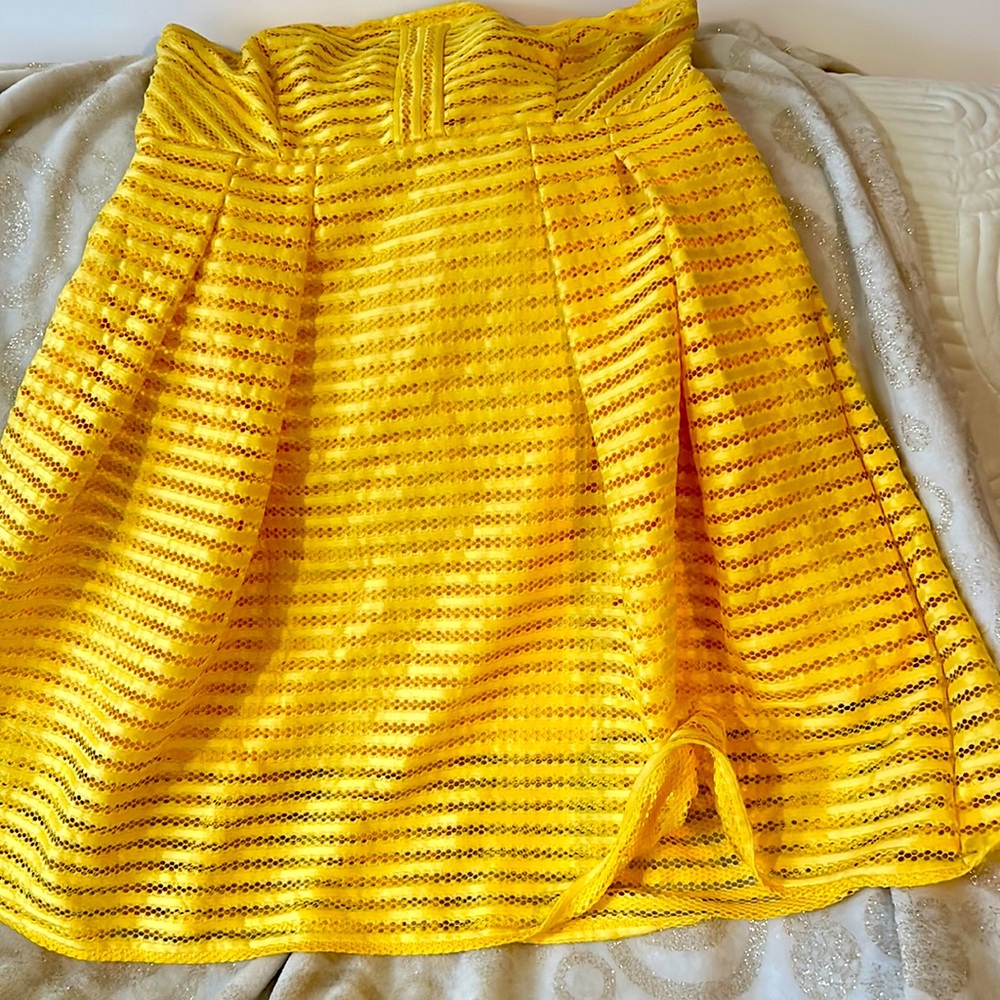 This was worn one time to a beach wedding and in a closet ever since like new.